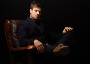 beautiful-shot-successful-businessman-sitting-leather-couch-thinking